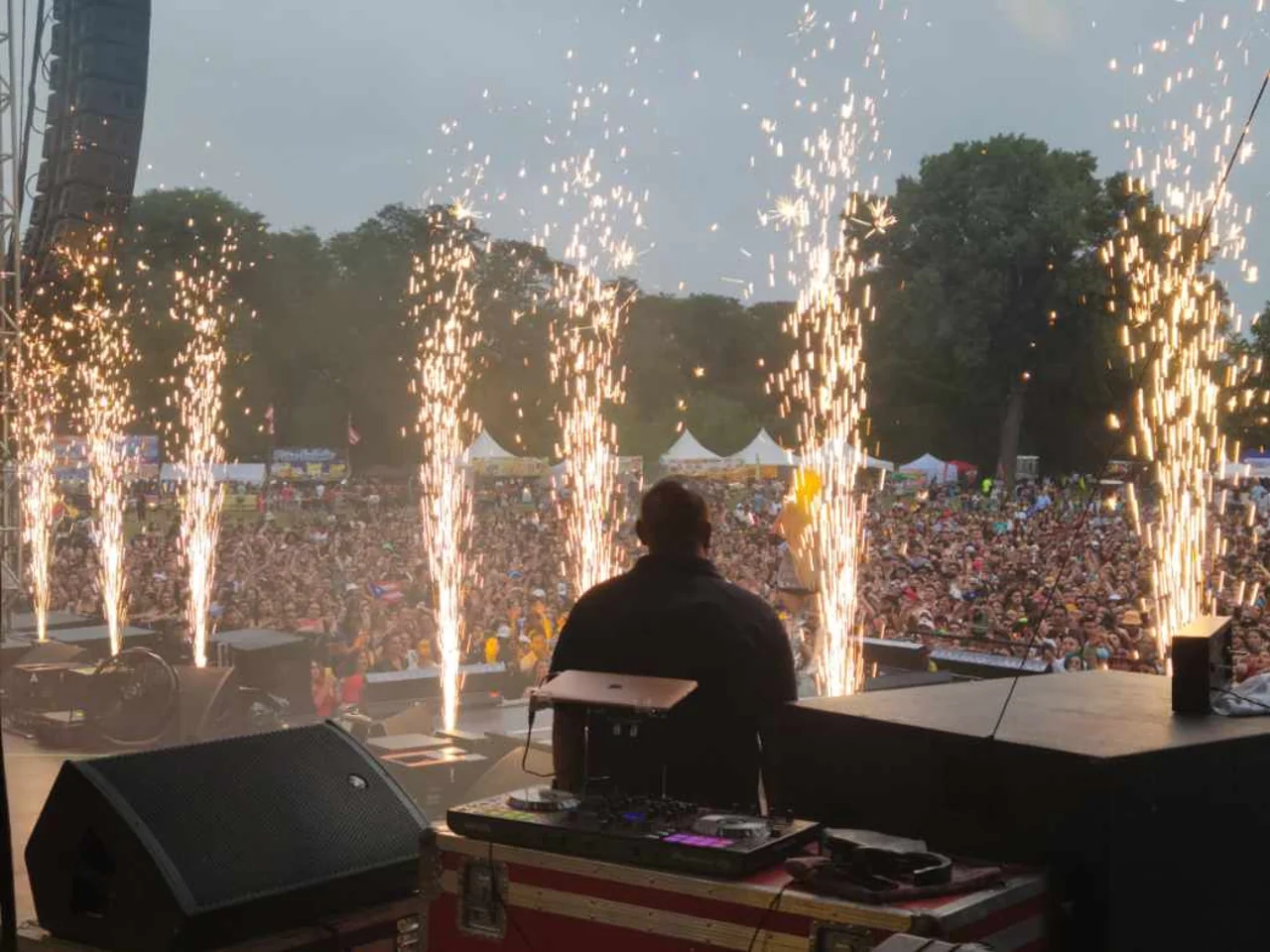 Stage pyrotechnic fountains in front of a live concert audience